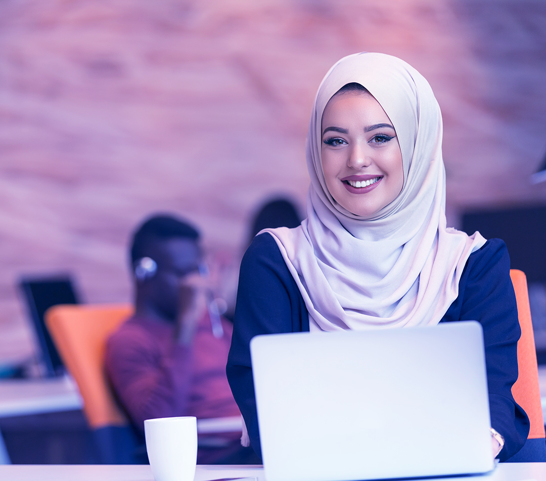 Young Arabic business woman wearing hijab,working in her startup office. Diversity, multiracial concept